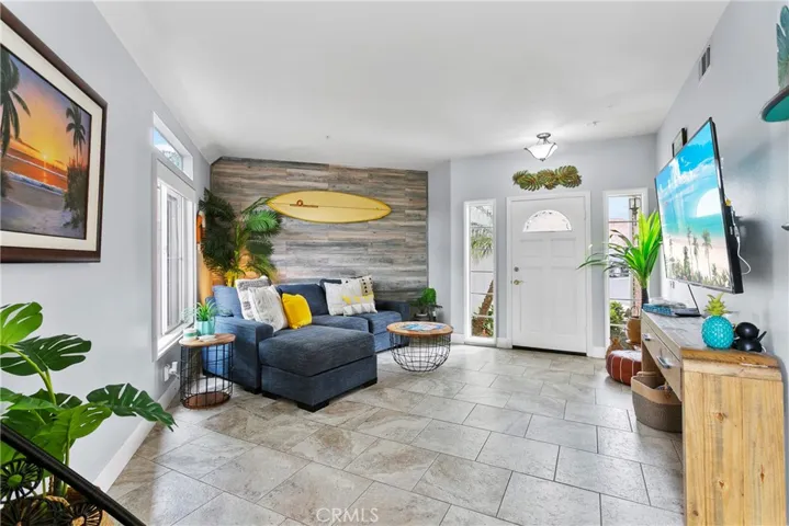 Large living space has plenty of room for the largest of the large flat screens...
