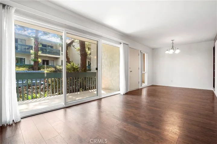 Wall of windows leading to balcony and view of the koi pond and the grounds