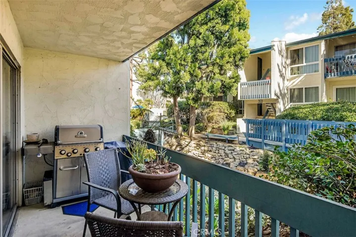 Enjoy a tranquil coffee or grill up dinner while listening to the babbling brook and watching the koi - Prior occupants' furniture