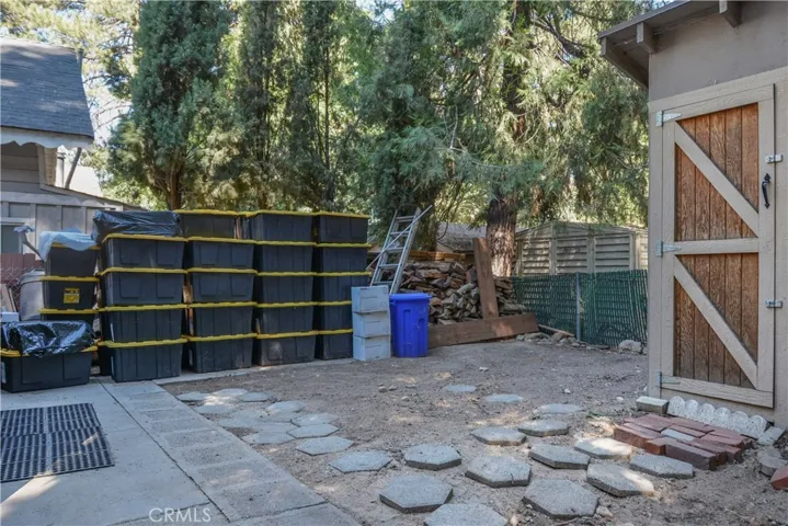 Fenced backyard shed stays