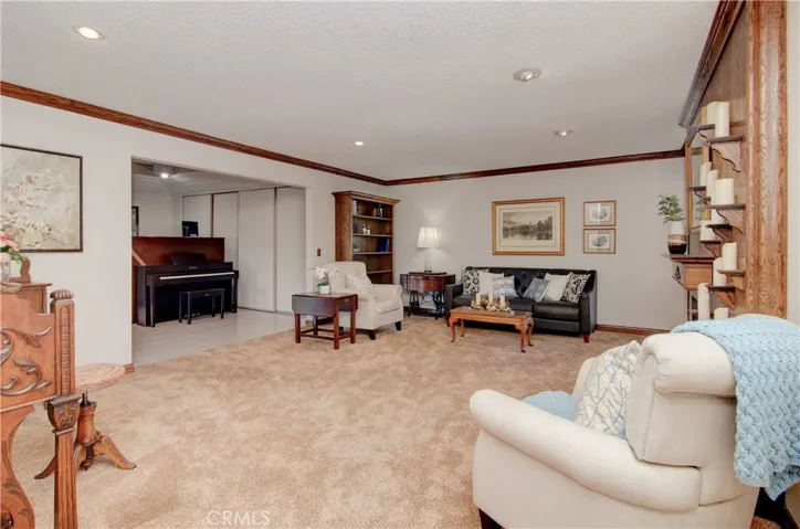 This is a BIG living room...plenty of furnishing options...crown molding, recessed lighting...and more!