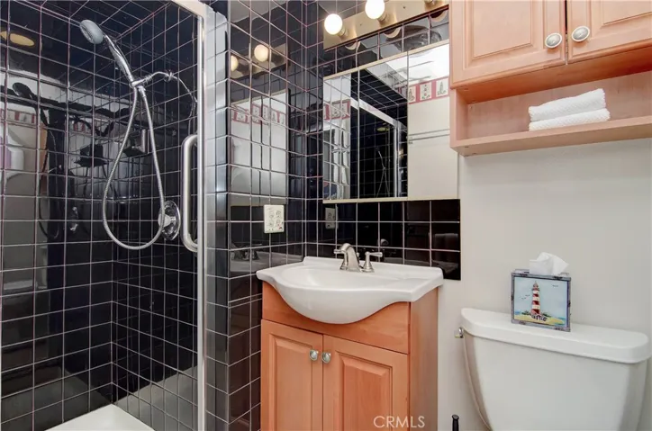 Master bath has custom shower and extra storage.