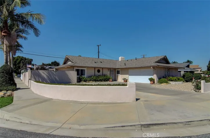 Enjoy ocean breezes rustling through mature palm trees on this oversized corner location...so many options for creating additional garage or living space...huge RV area too!