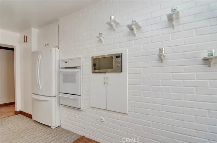 This "BBQ" floor plan offers indoor BBQ grill option...brick wall adds nice warm touch to kitchen too.