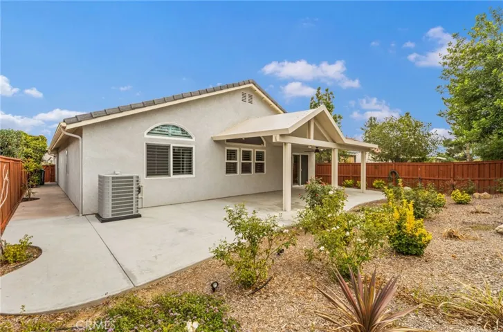 Rear view of home with wide sideyard