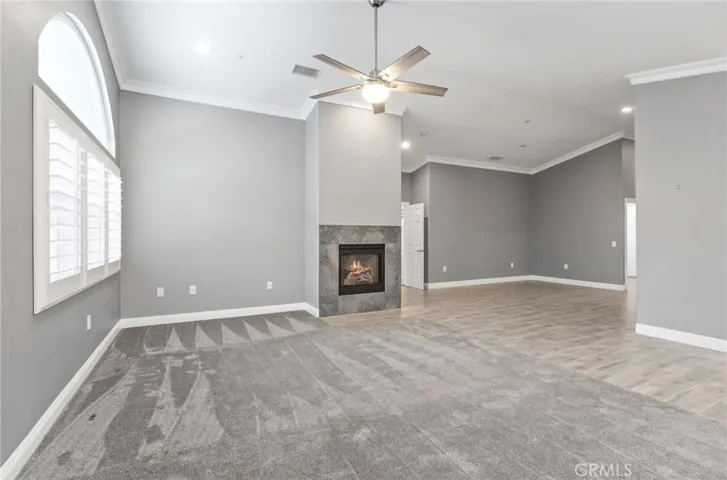 Vaulted ceilings accentuated by crown mouldings throughout