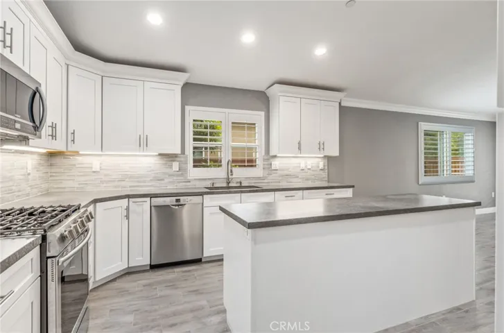 Newer top of the line appliances and handsome quartz countertoops!