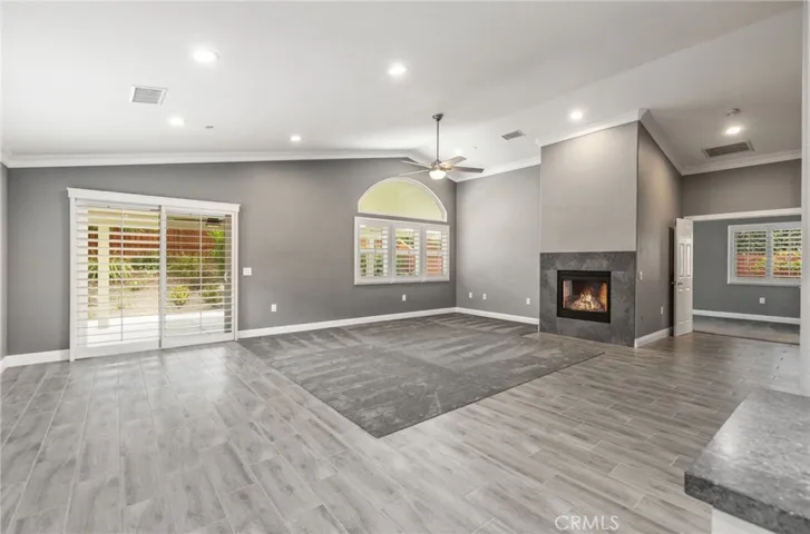 Beyond the family room is the master suite to the right