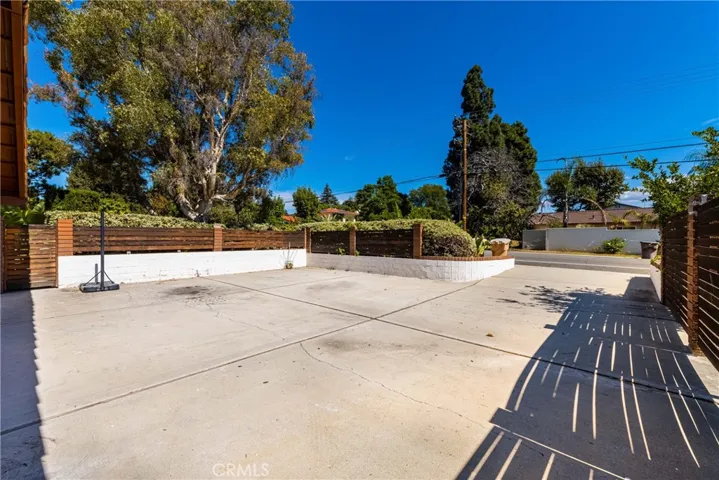 Large driveway that could be used for playing games, parking a number of cars or possible RV.