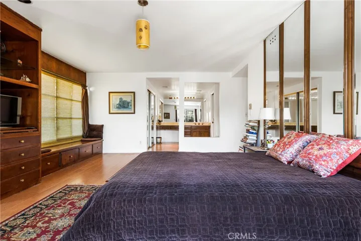 Large master bedroom with wardrobe and walk-in closet.