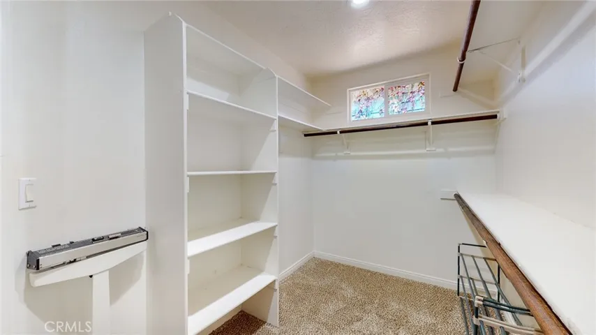 Walk in closet with room for wardrobe for both