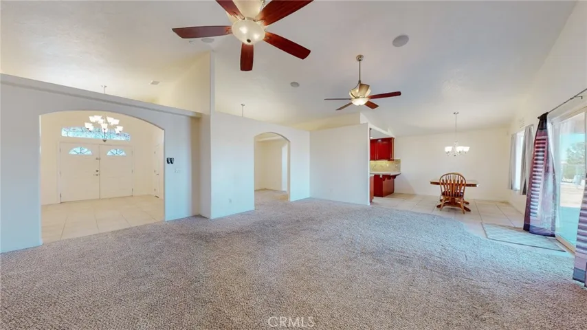 In living room: View to entry, dining room and eat in kitchen area