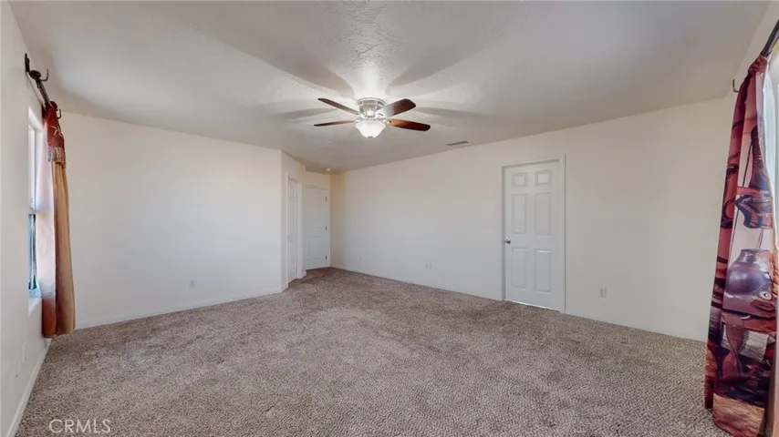 This Primary Bedroom (Master En Suite) sits in the rear of the home.
