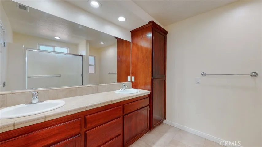 Dual vanity with full mirror and linen closet!