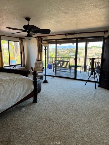 Upstairs large master bedroom with balcony