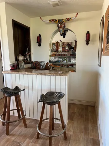 Wetbar opening to both den and kitchen of den