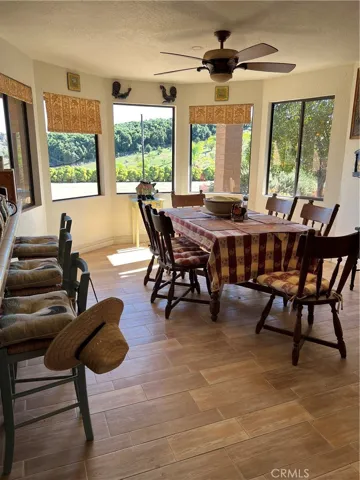 Light bright dining room with views of the property