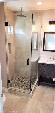 Frameless shower doors, custom tilework; WOW!