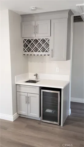 Wet bar with mini-fridge.
