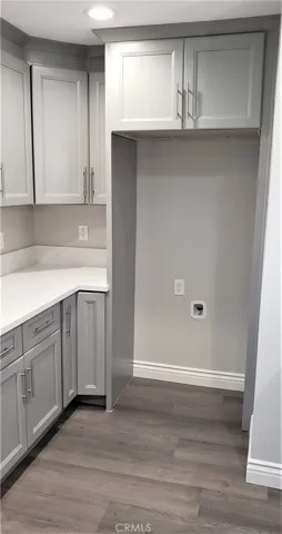 Deep storage on top of fridge housing.