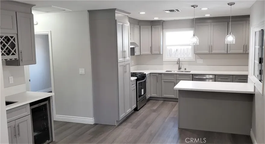 Dining table faces wet-bar; great for hosting!
