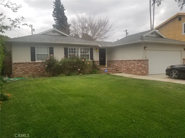 Front View of home.  The home faces east with plenty of front yard space with sprinkler system.