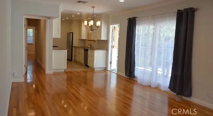 patio doors exit to beautiful backyard space.