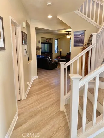 Downstairs hallway to Living room and Den