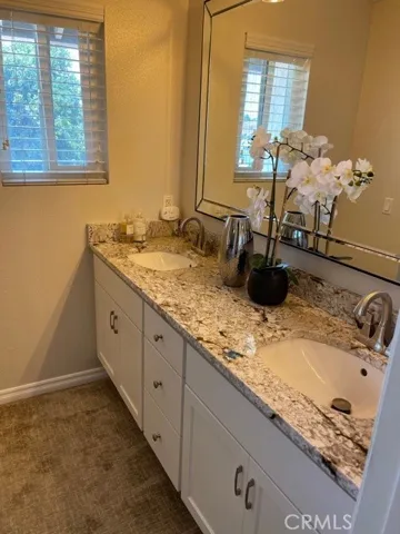 Updated master bathroom with new cabinets and granite counters