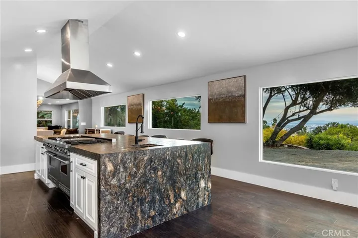 Huge island counter space and sub zero and Viking appliances.