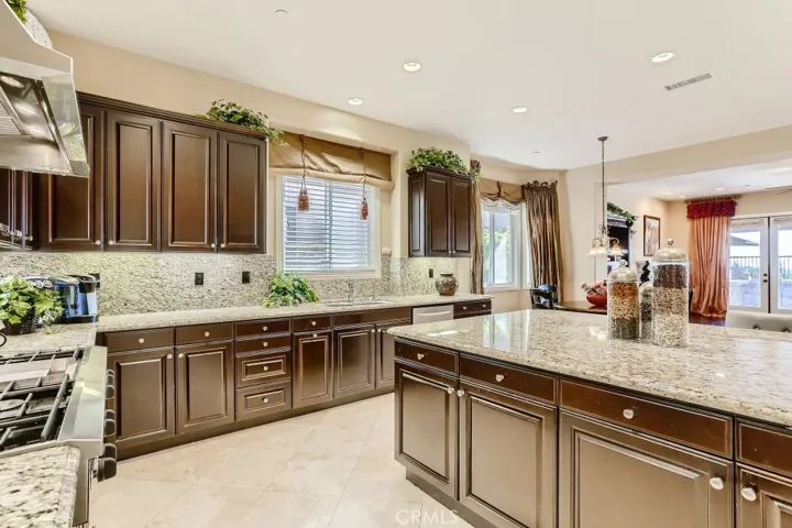 Full granite backsplash, 6 burner stove and hood