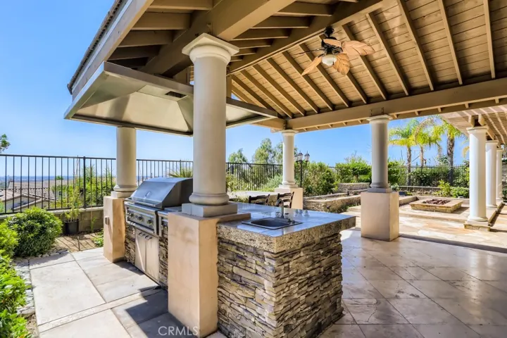 Covered outdoor BBQ with sink and hood