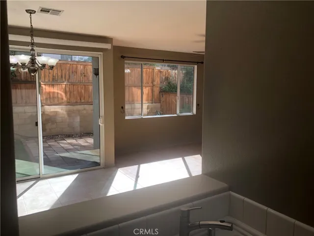 Open dining, kitchen sink and living room