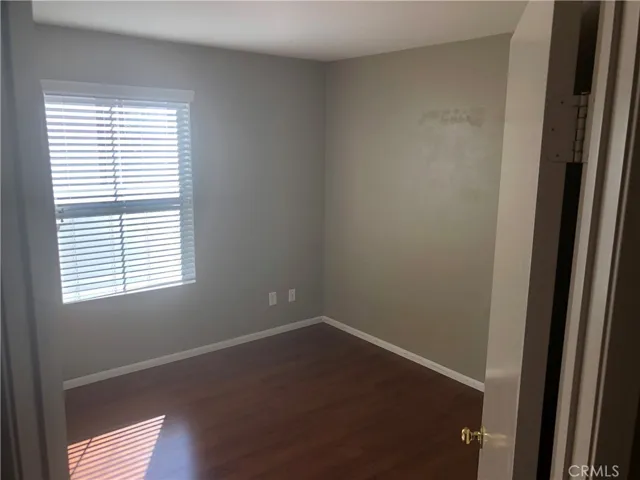 2nd bedroom with laminate floors
