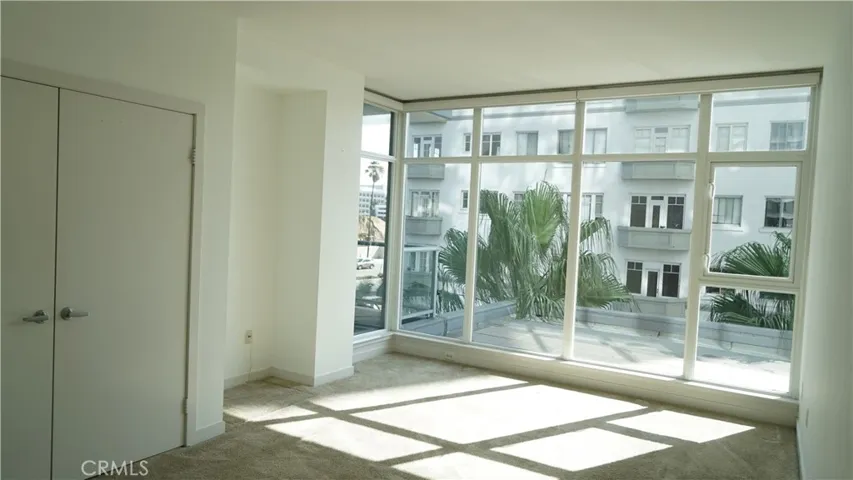 Primary suite with large wardrobe and storage.