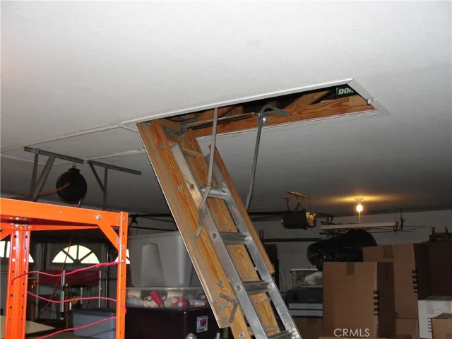 3 car garage with stair access into attic space.  Great storage potential.