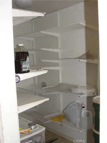 Large pantry storage area off kitchen across from laundry area.