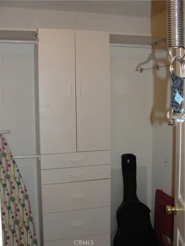 His and hers closets.  This is walk in closet #1