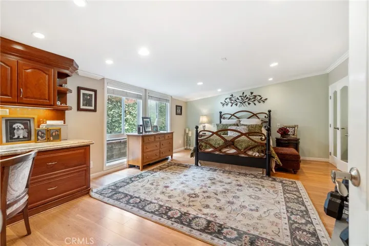 Master bedroom showing large sitting area and built in desk