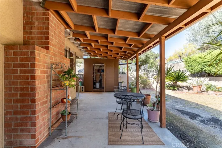covered patio with included metal outdoor furniture
