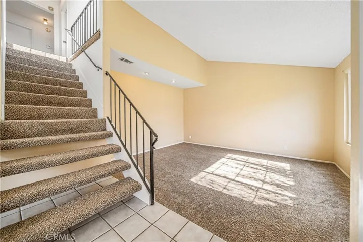 Stairs off entry leading to bedrooms