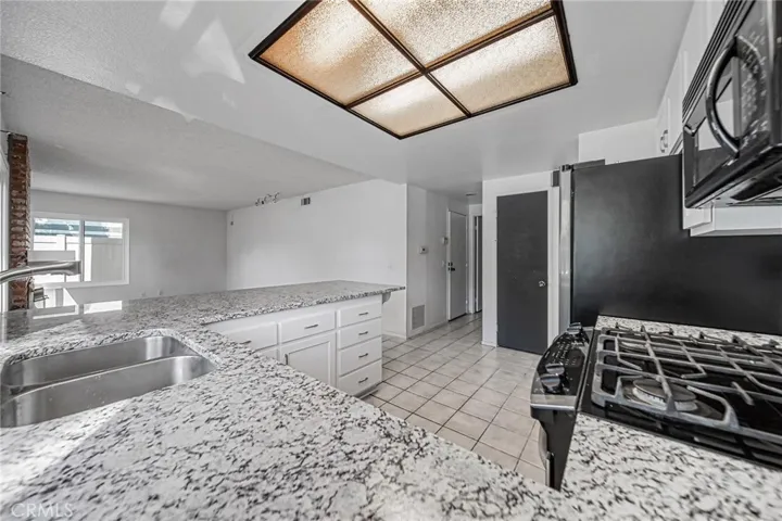 Kitchen with access to laundry, 1/2 bath and garage access.