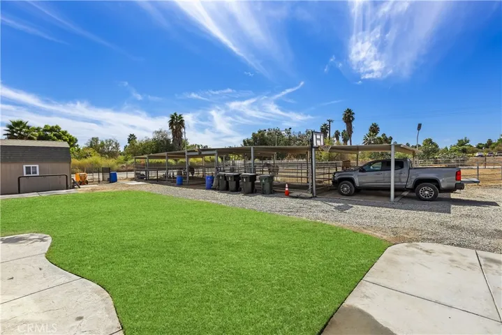 Horse stalls are completely covered with an additional carport