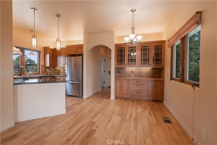 Kitchen and living room (with pantry, laundry room and garage on this end)