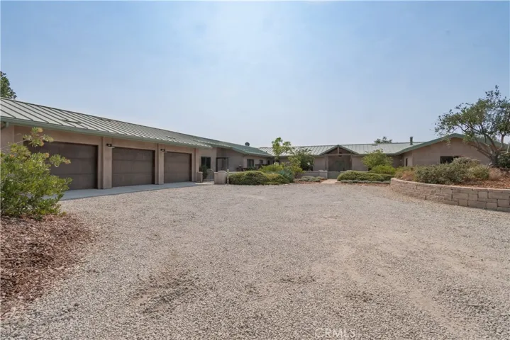 3 car garage attached to guest house (left) and main house (straight on view)