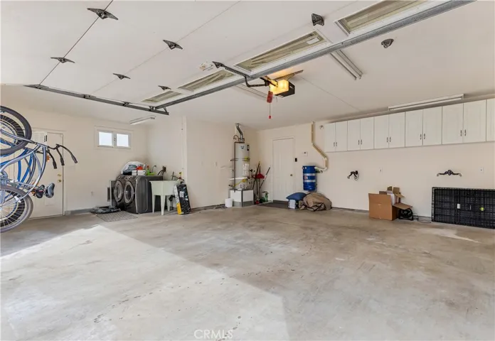 Oversized garage, stocked with body boards, chairs etc