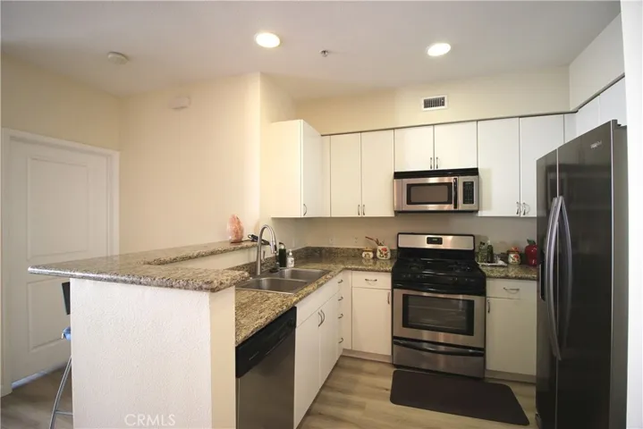 Kitchen with stainless-steel appliances