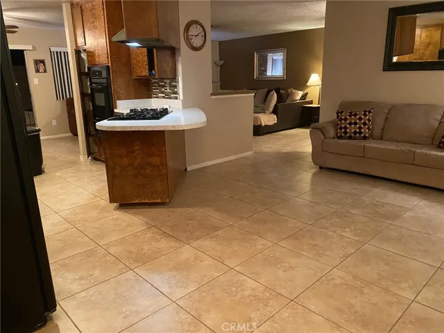 Looking from Dining area to kitchen (Left) and Family Room (Right)