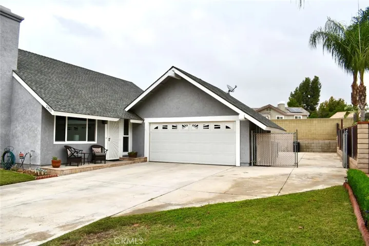 Front of the house showing gated RV Parking.