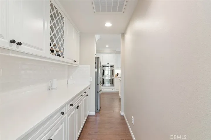 Large pantry area connect the kitchen to the formal dining room, for seamless flow when hosting dinner parties.